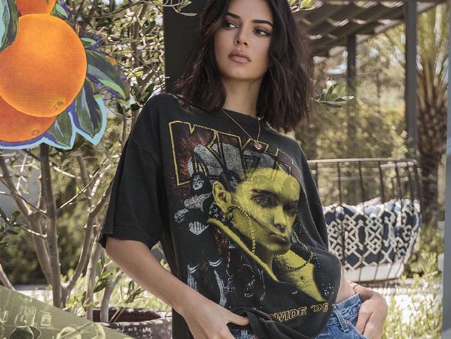 The controversial T-shirts feature Kendall and Kylie Jenner's faces over images of iconic bands