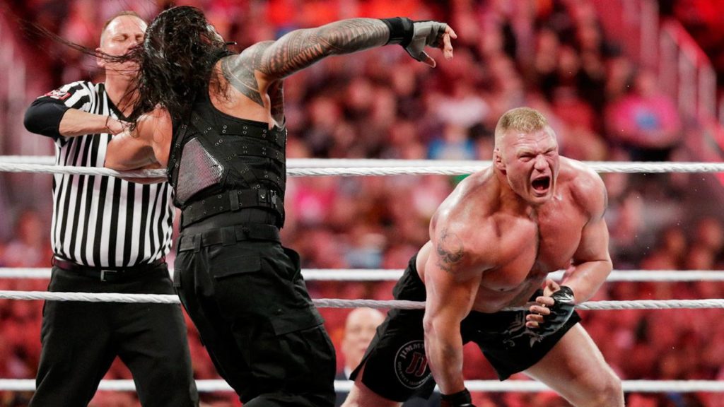 Brock Lesnar Attacks Cuffed Roman Reigns