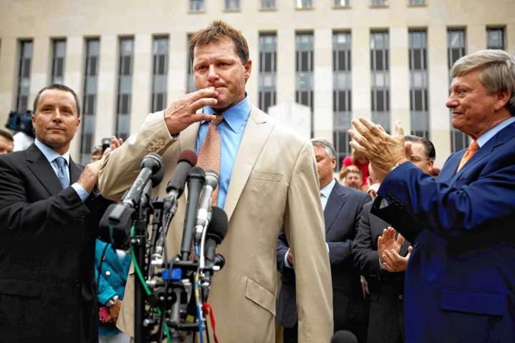 Former Major League Baseball pitcher Roger Clemens (R) leaves the U.S. District Court after